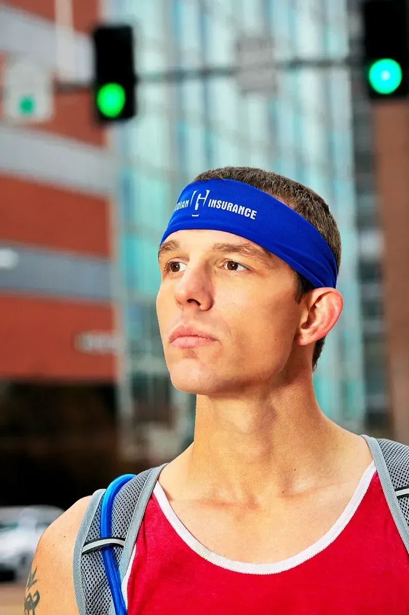 Custom Impulse cooling headband worn by a runner with logo-ready print