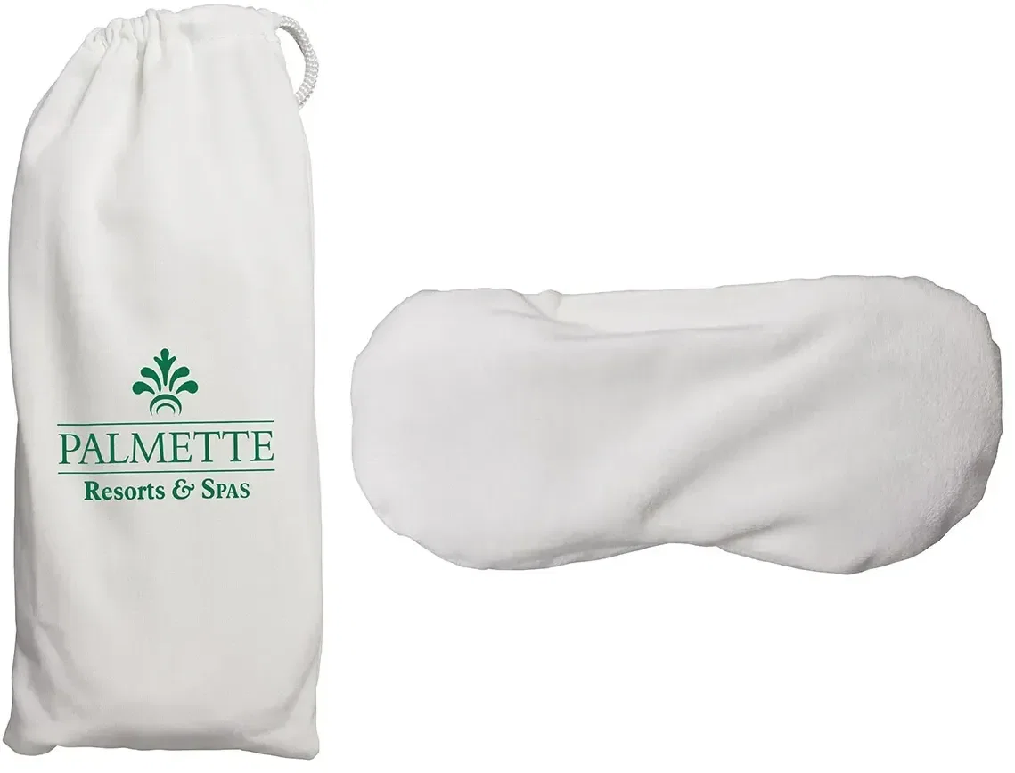 Close-up of the custom Lavender Wonder Beads eye mask showing its soft fabric and logo area
