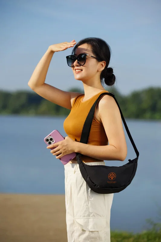 Angled view of the branded Lune Microfiber Waist Bag
