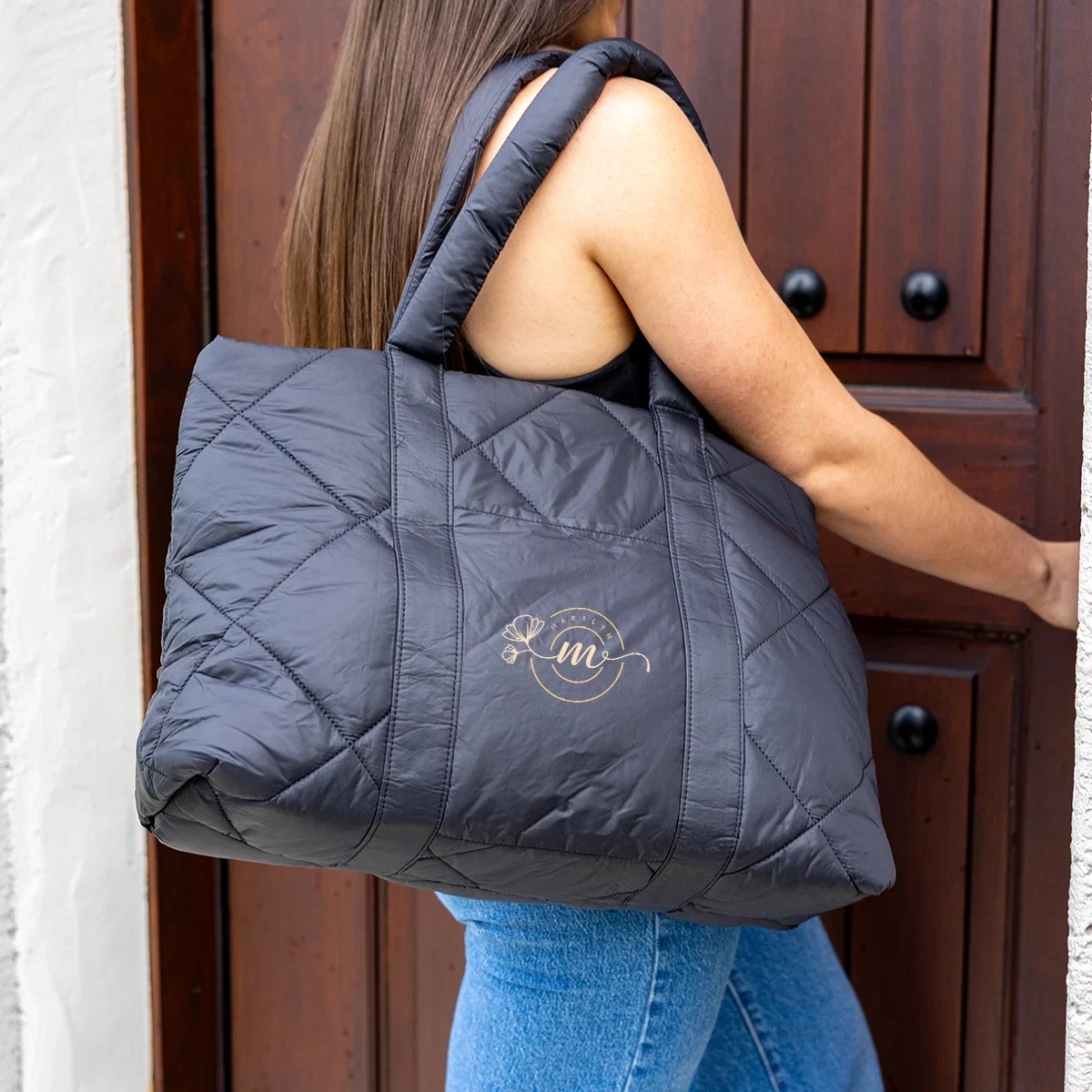 Luxe Quilted Puffer Tote Bag held in hand