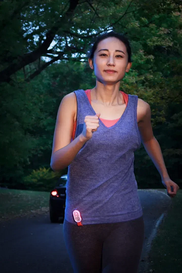 Angled view of the branded Magna Clip magnetic safety light for runners and cyclists after dark