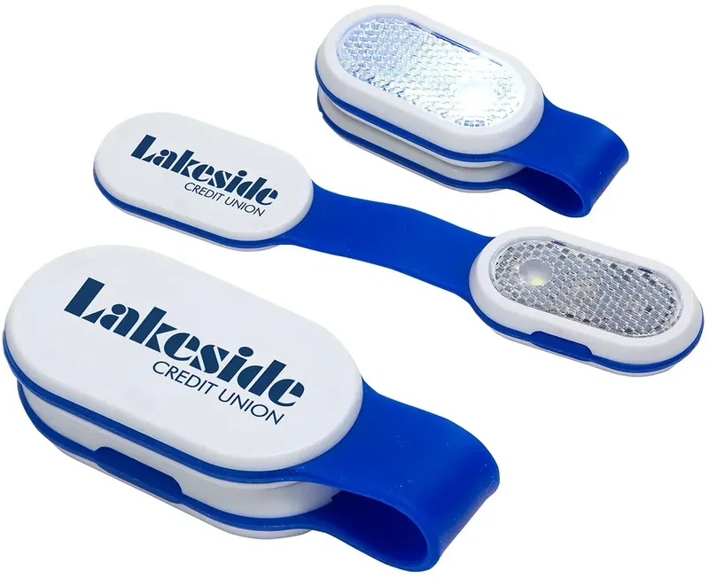 Clip-on detail of the custom Magna Clip magnetic safety light worn on clothing, branded promotional light