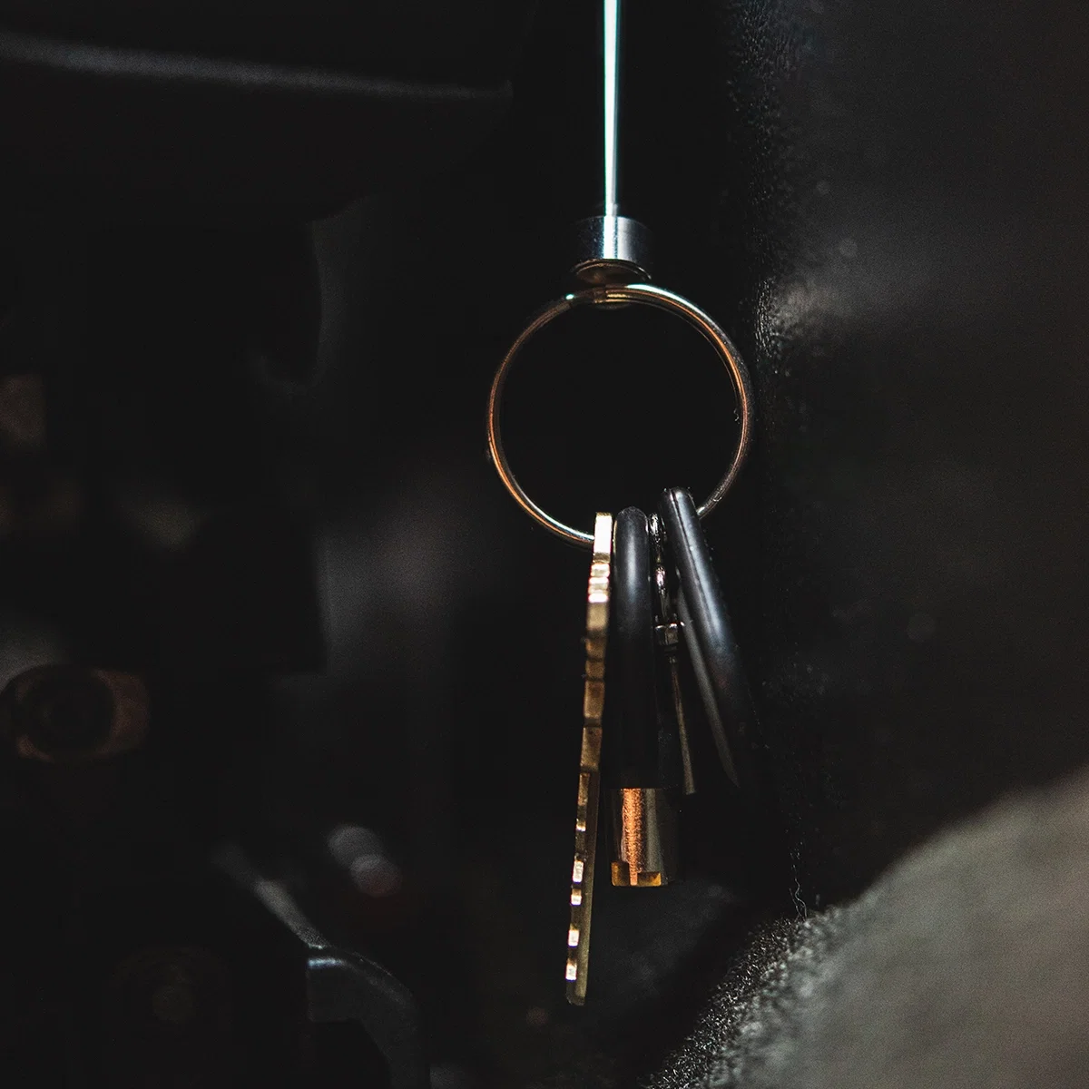 Magnet tip picking up a small metal screw