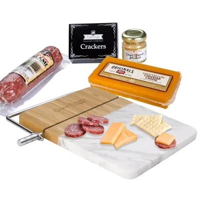 White marble cutting board paired with matching charcuterie tools