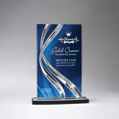Curved acrylic form shown against a plain backdrop