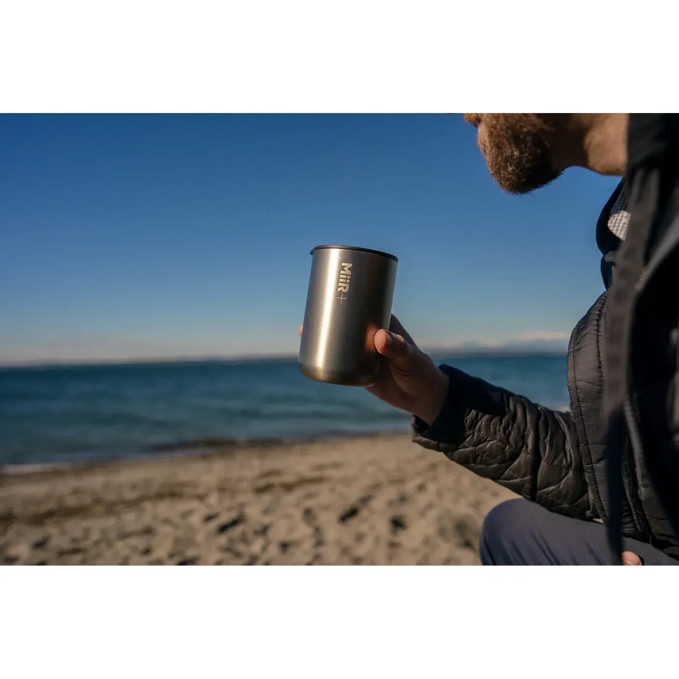 MiiR® Climate+ Tumbler - 16 Oz. held in hand