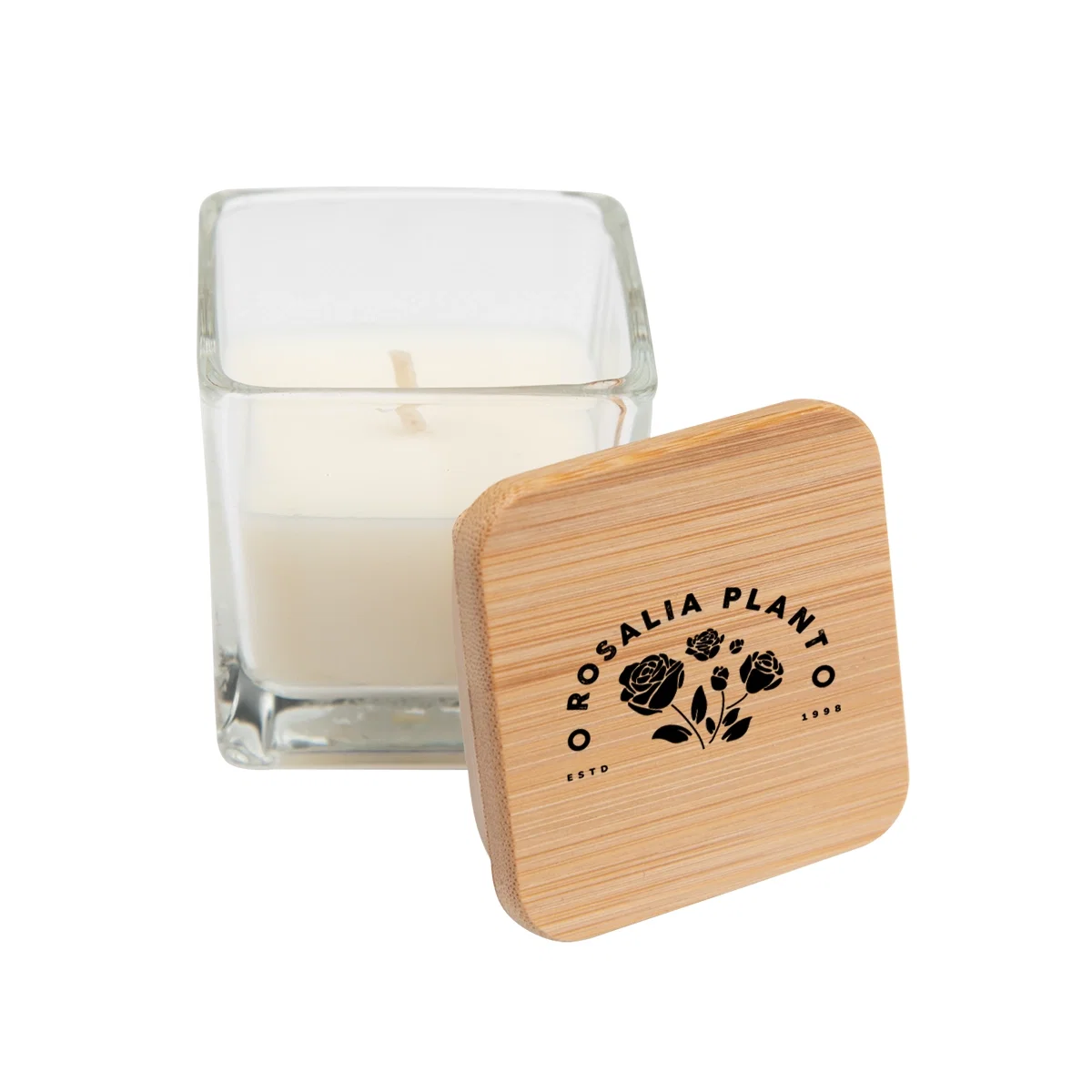 Bamboo lid resting beside the small clear candle