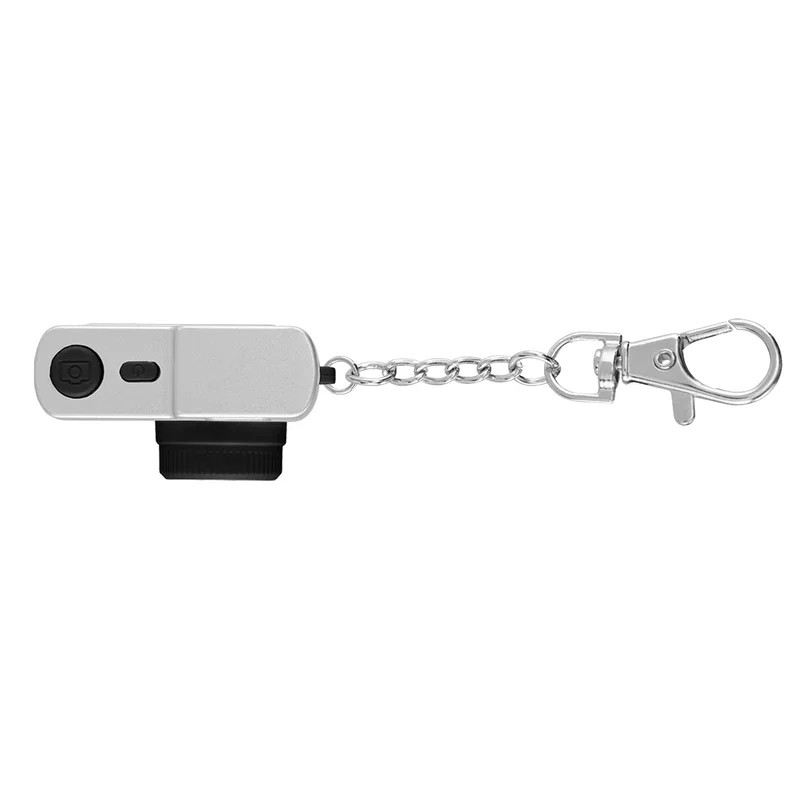 Clipped onto a bag zipper by its ring