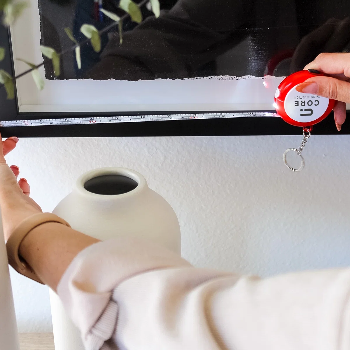 Multi-Tool Tape Measure With Light held in hand