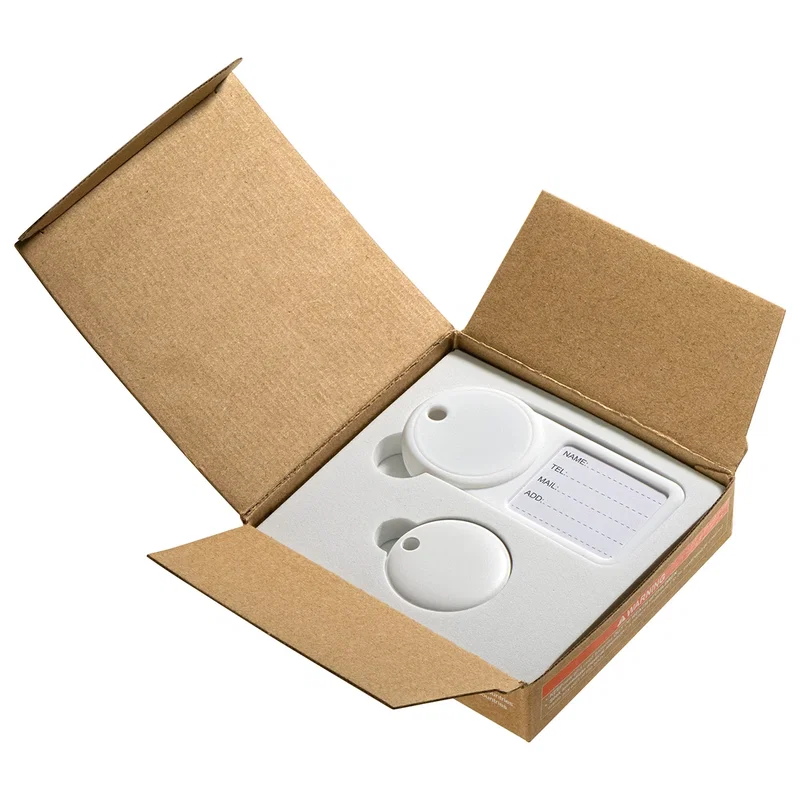 Navi Air Tracker and luggage tag combo packaging opened, showing the foam tray insert with the tag and tracker