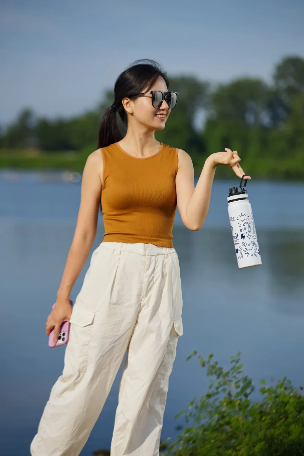 Nomad 27 oz Insulated Infuser Bottle held in hand
