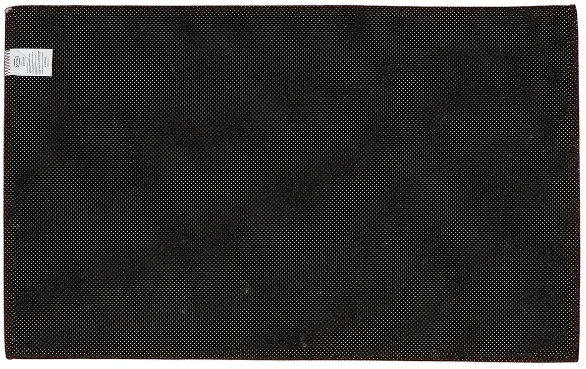 Corner detail of the branded non-skid tufted indoor rug showing the tufted pile and logo print