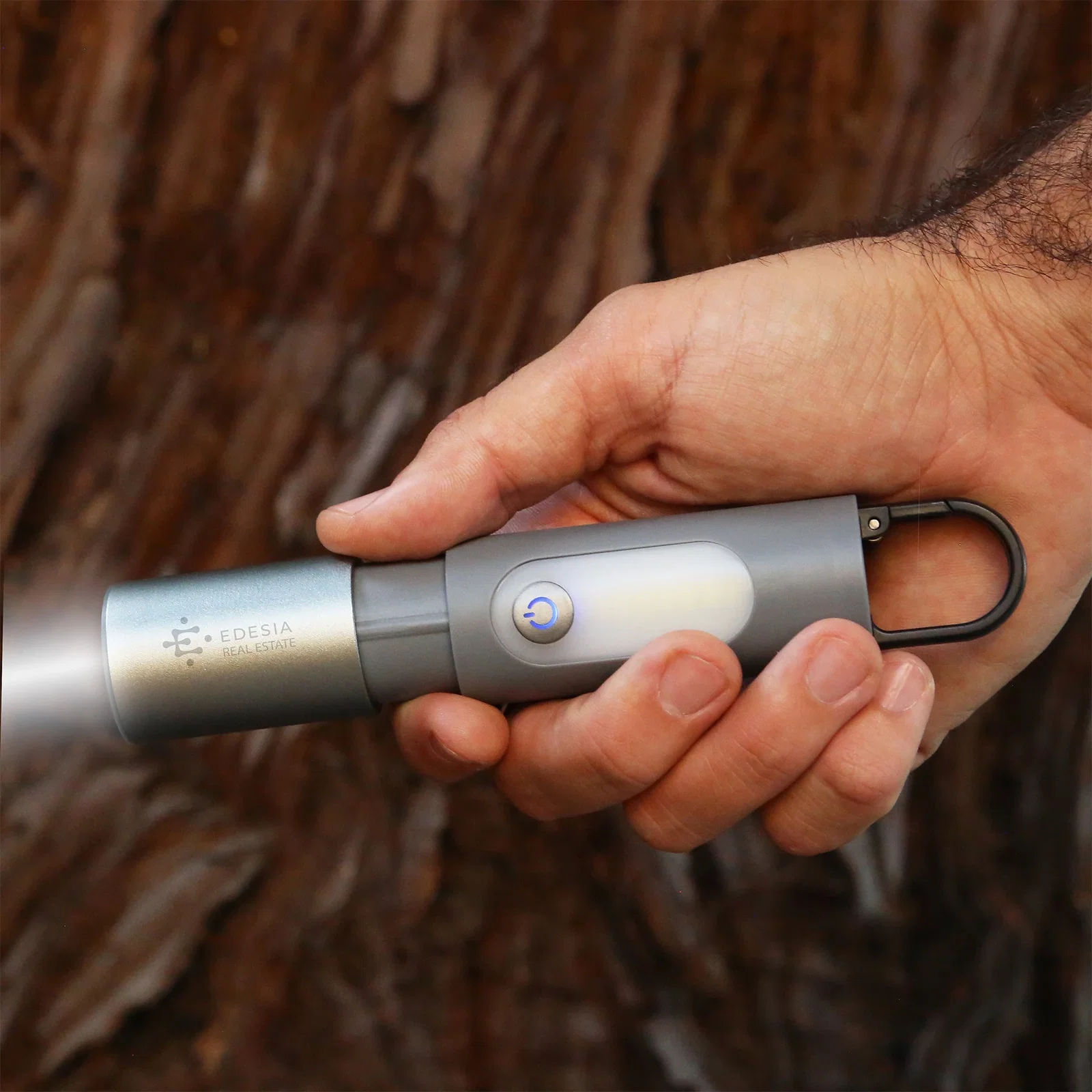 Odyssey Point Flashlight held in hand
