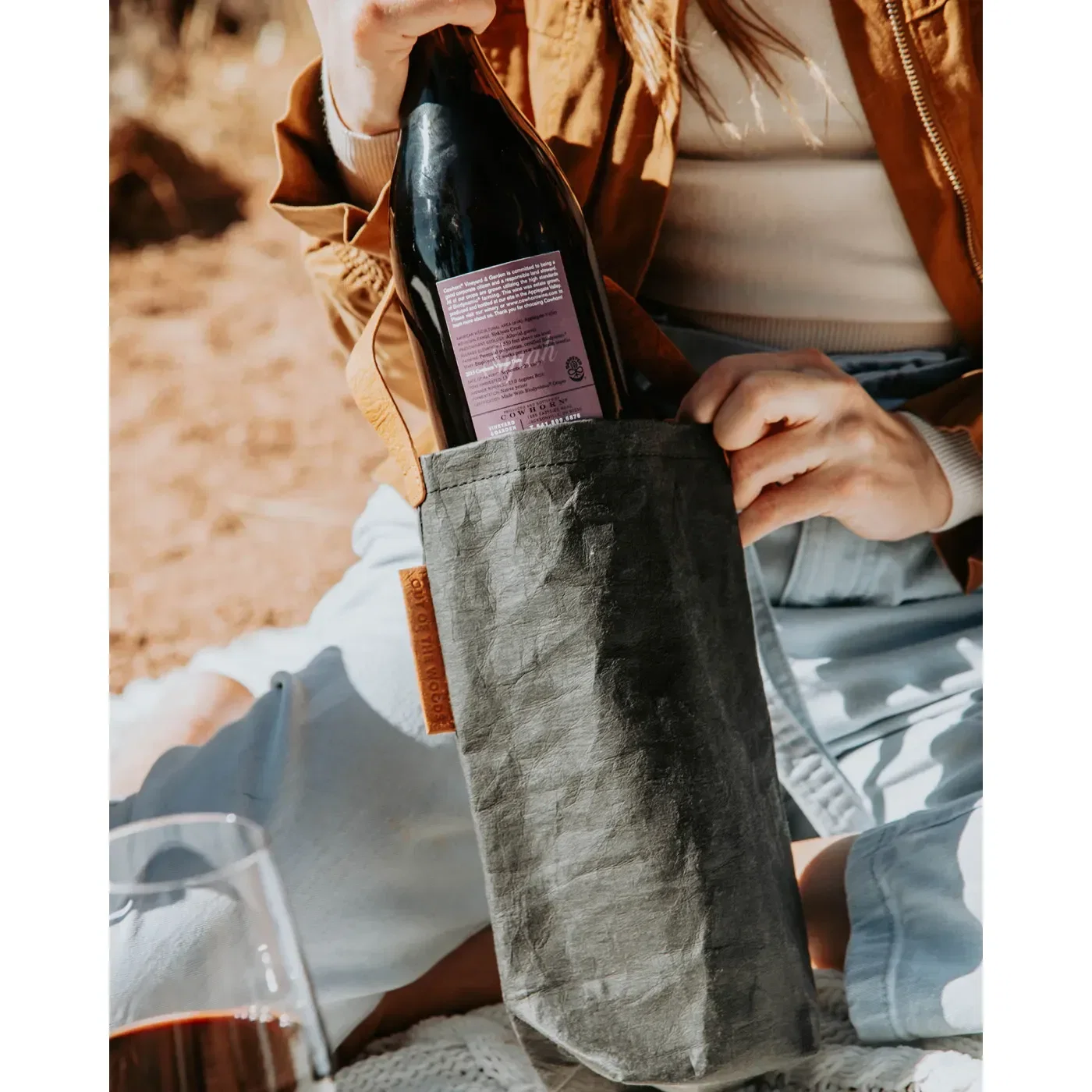 Out of The Woods® Connoisseur Wine Tote held in hand