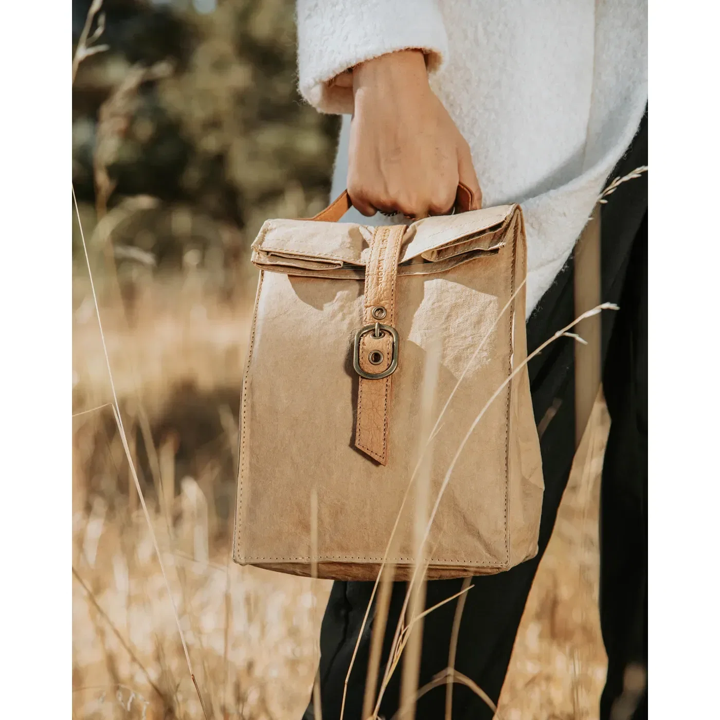 Out of The Woods® Reusable Paper Lunch Bag 2.0 held in hand