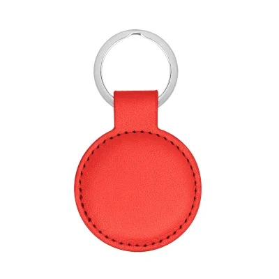 Red round key holder photographed straight on