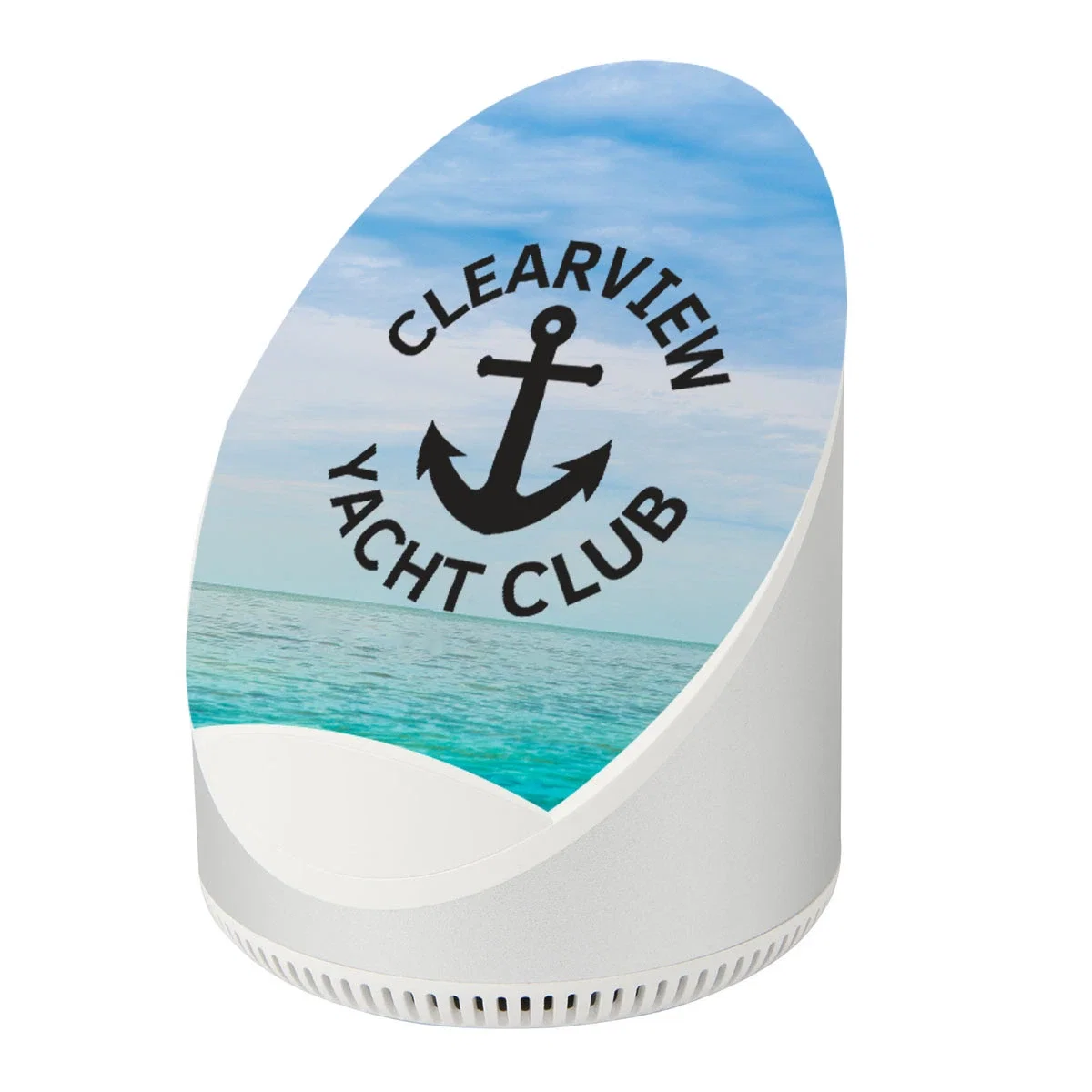 Round silver wireless speaker that also charges a phone on top