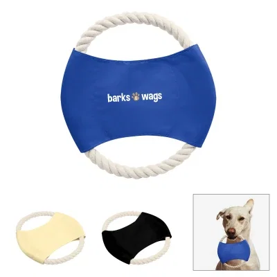 Dog carrying the ring across the grass