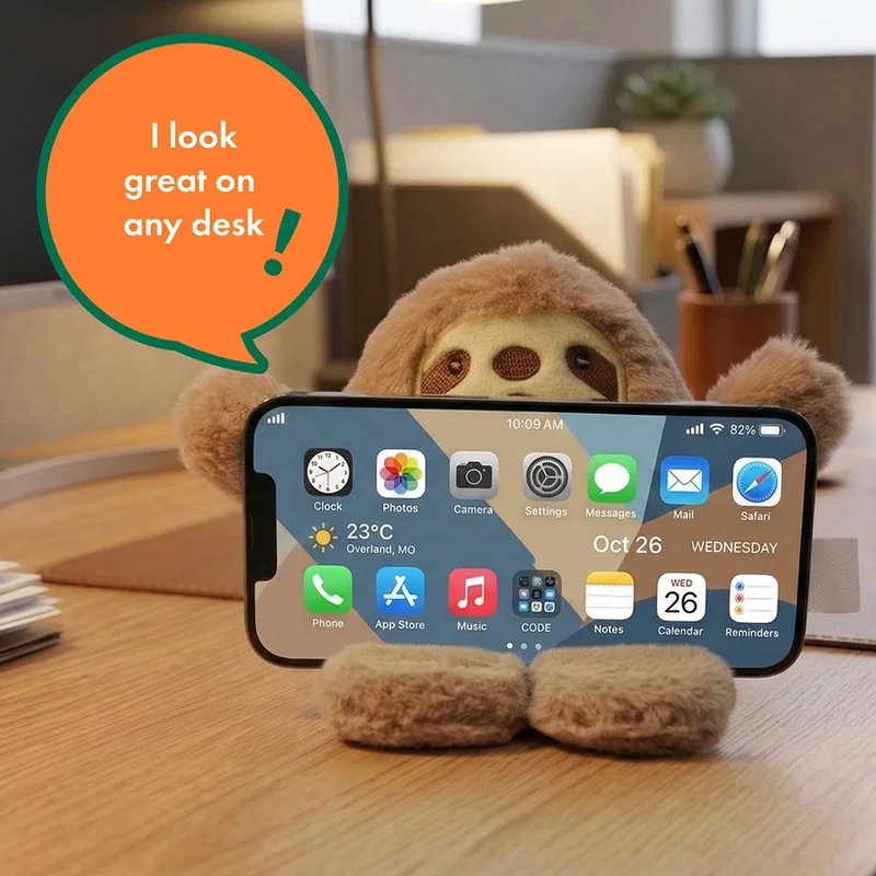 Phone Pals Weighted Plush Phone Holder shown on a nightstand, lifestyle shot, style 3 of 3
