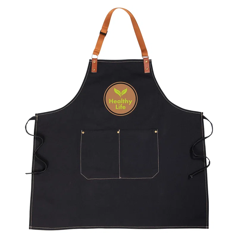 Promotional Pitmaster Recycled Cotton Apron worn while grilling, branded apron lifestyle shot