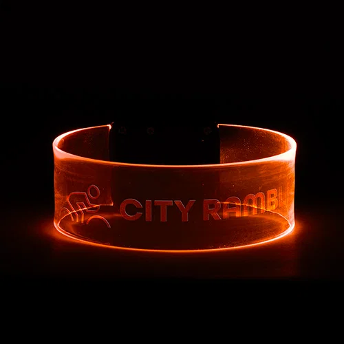 Branded Pixie light-up wristband in blue glow, custom promotional color-changing LED wristband