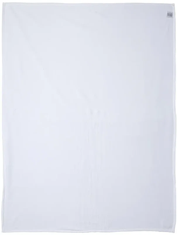 Custom 300GSM brushed fleece blanket draped over a chair, soft texture detail