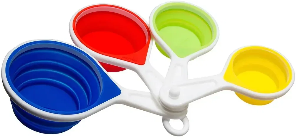 Custom Pop-Out silicone measuring cups collapsed flat showing imprint area, branded promotional set