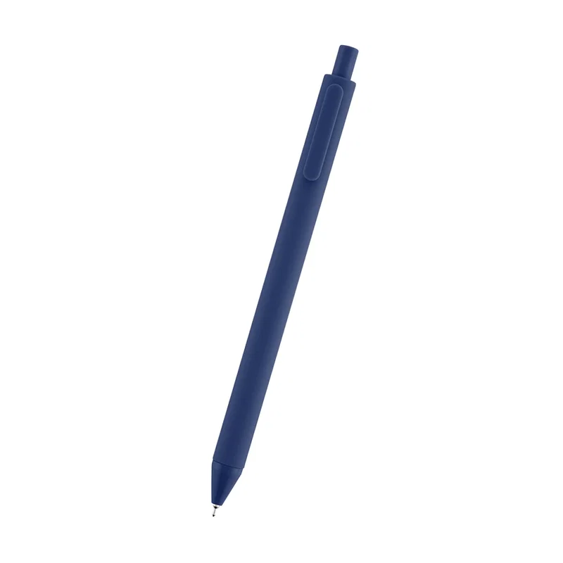 Pen paired with a spiral pad on a work desk
