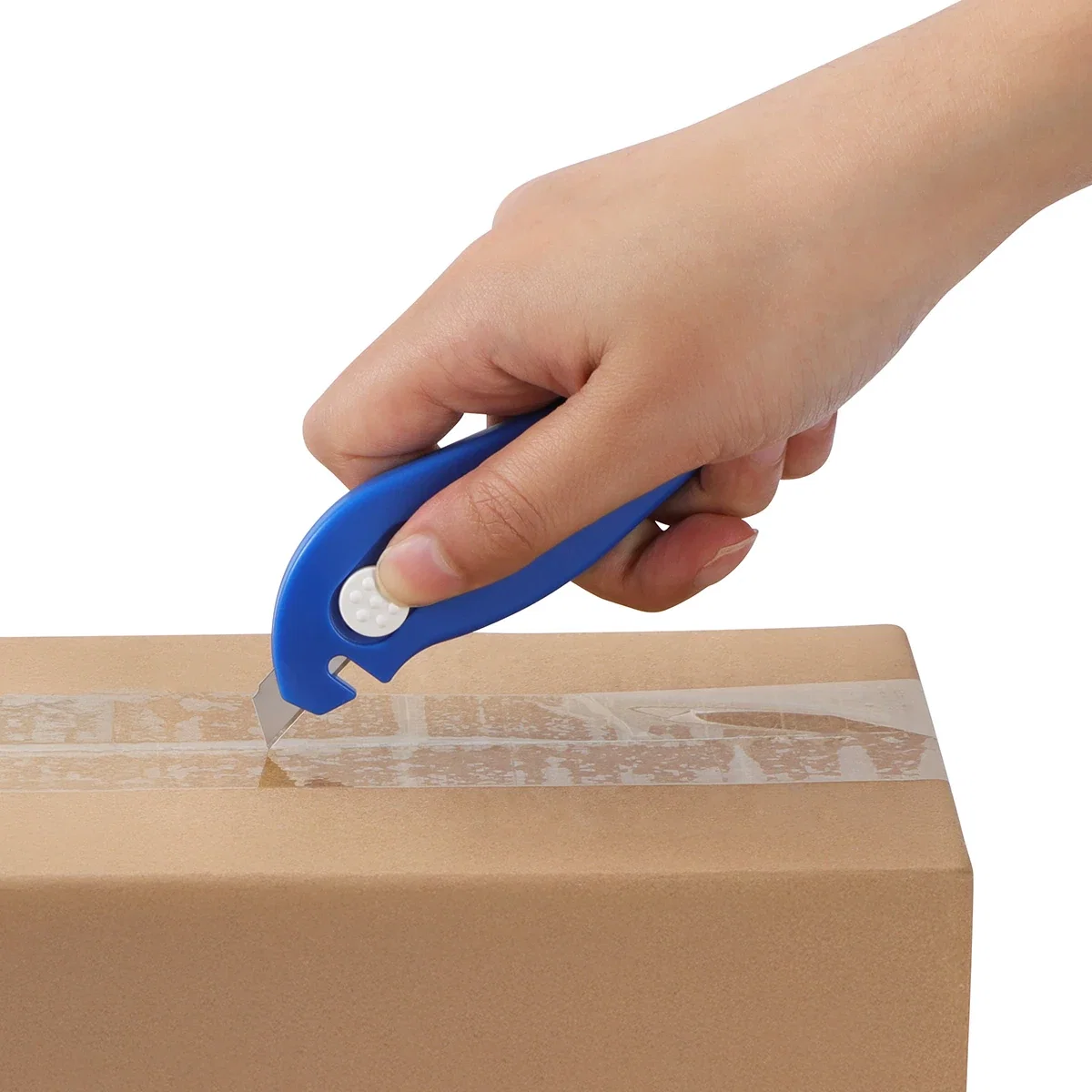 Porter 3-in-1 box cutter slicing through packing tape on a cardboard box, blade extended