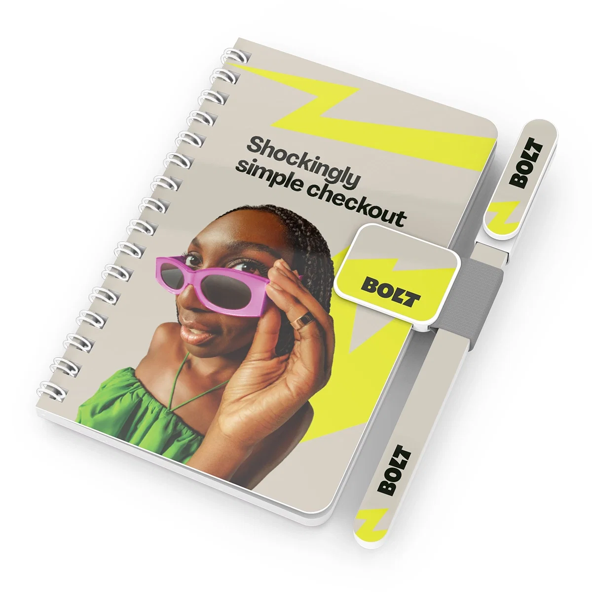 Notepad measuring about five inches across shown next to the pen