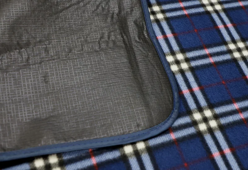 Side profile of the folded Premium Barrel Fleece Picnic Blanket