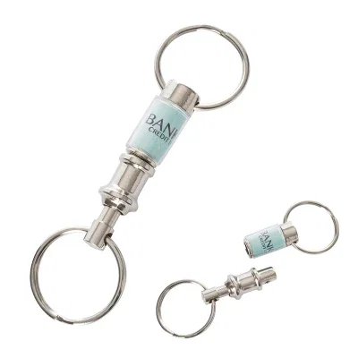 Silver key tag that pulls apart into two pieces