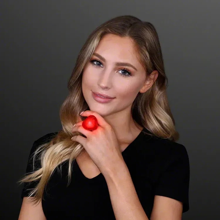 Pulsing Light Red Heart Ring being worn