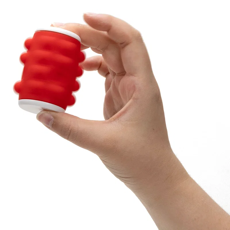 Custom branded Push Pop spinning top, in-hand shot