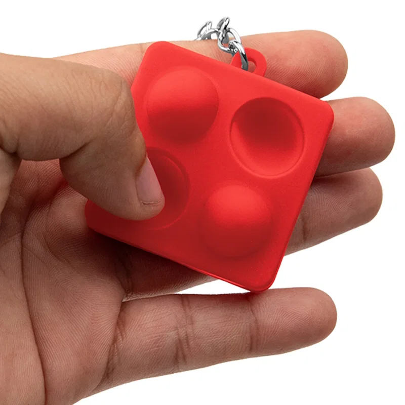 Overall form of the push pop keychain shown clearly