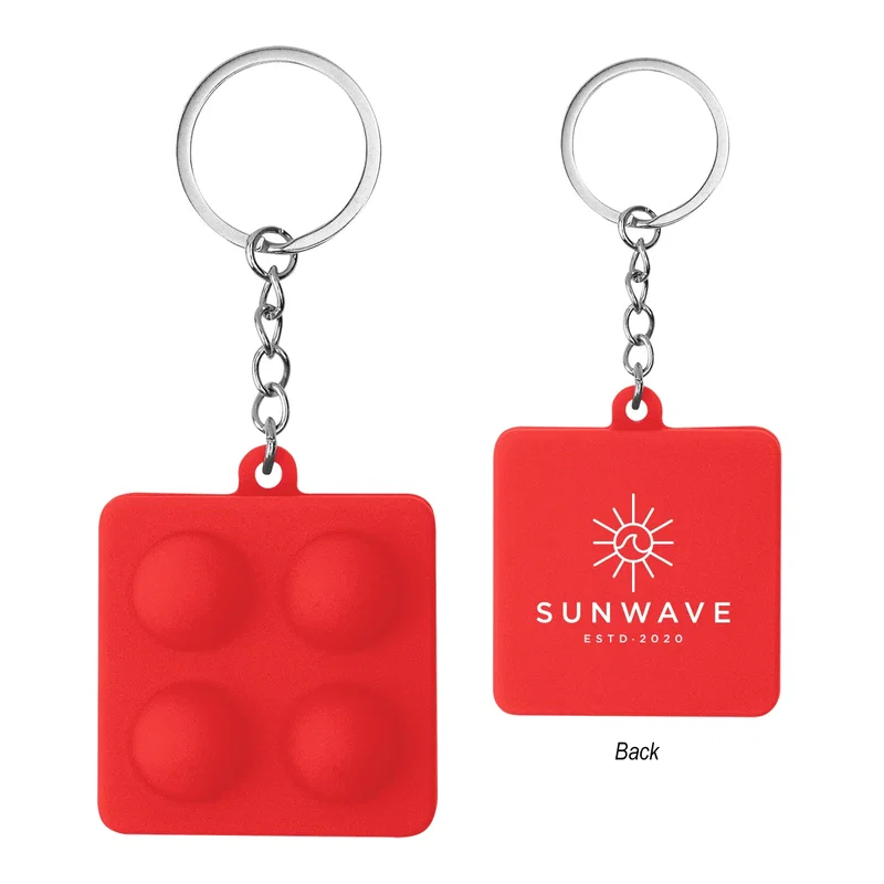 Two-thirds view of the push pop keychain tilted slightly
