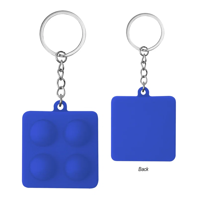 Neutral backdrop keeps attention on the push pop keychain