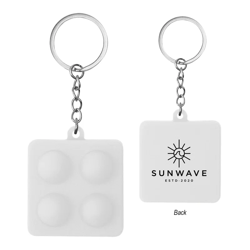 Left-side framing of the push pop keychain standing alone
