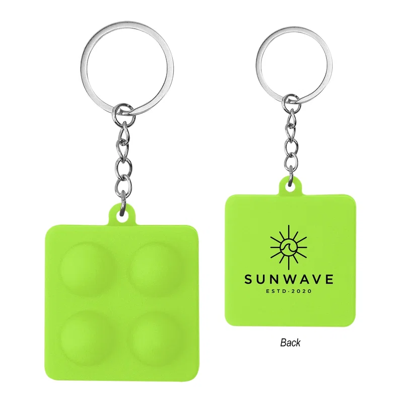 Elevated angle looking across the push pop keychain