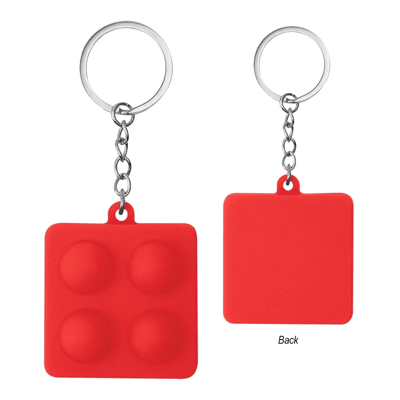 Whole push pop keychain pictured with the reverse face on show