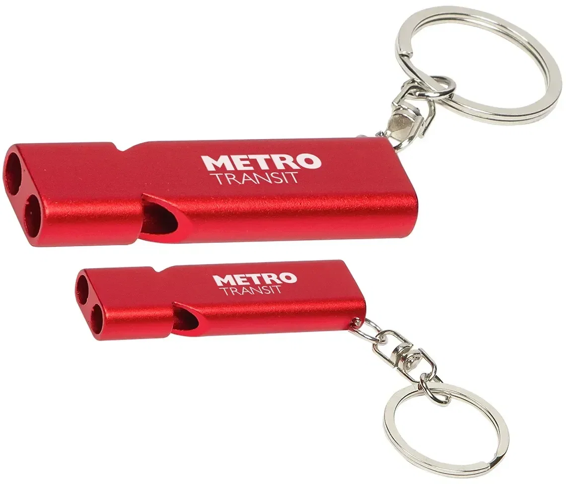 Custom Quick-Alert aluminum whistle clipped onto a lanyard, branded detail