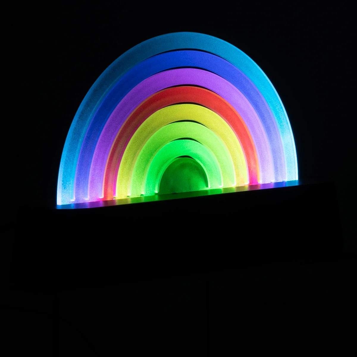 Rainbow Sound-Reactive LED Ambient Light glowing in multiple colors against a dark background