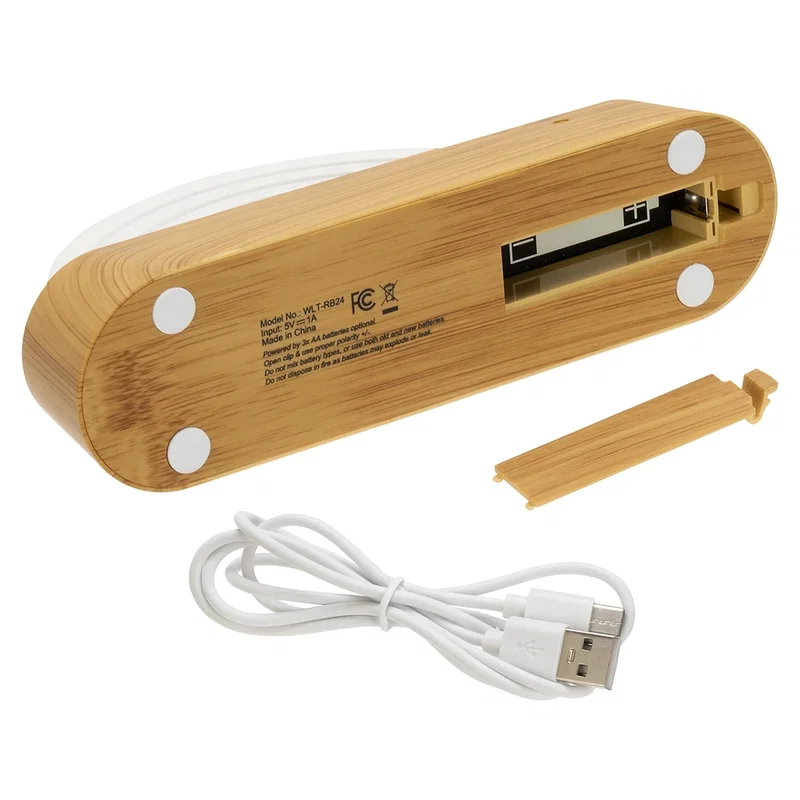 Underside of the Rainbow Sound-Reactive LED Ambient Light showing the open AA battery compartment and included USB charging cable