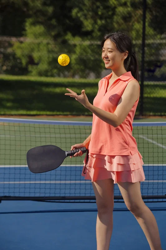 Rally Pickleball Set laid out on the court, promotional paddle set in use
