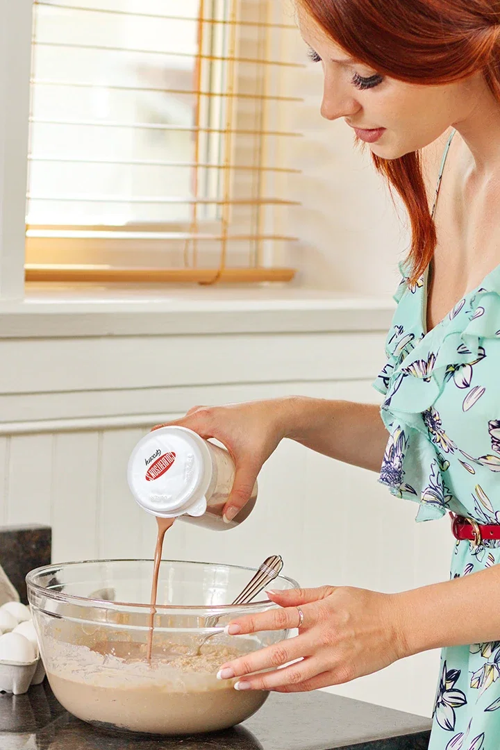 Close-up of the Recipe-Ready Measuring Cup Set's dual-strainer lid and nesting measuring spoons
