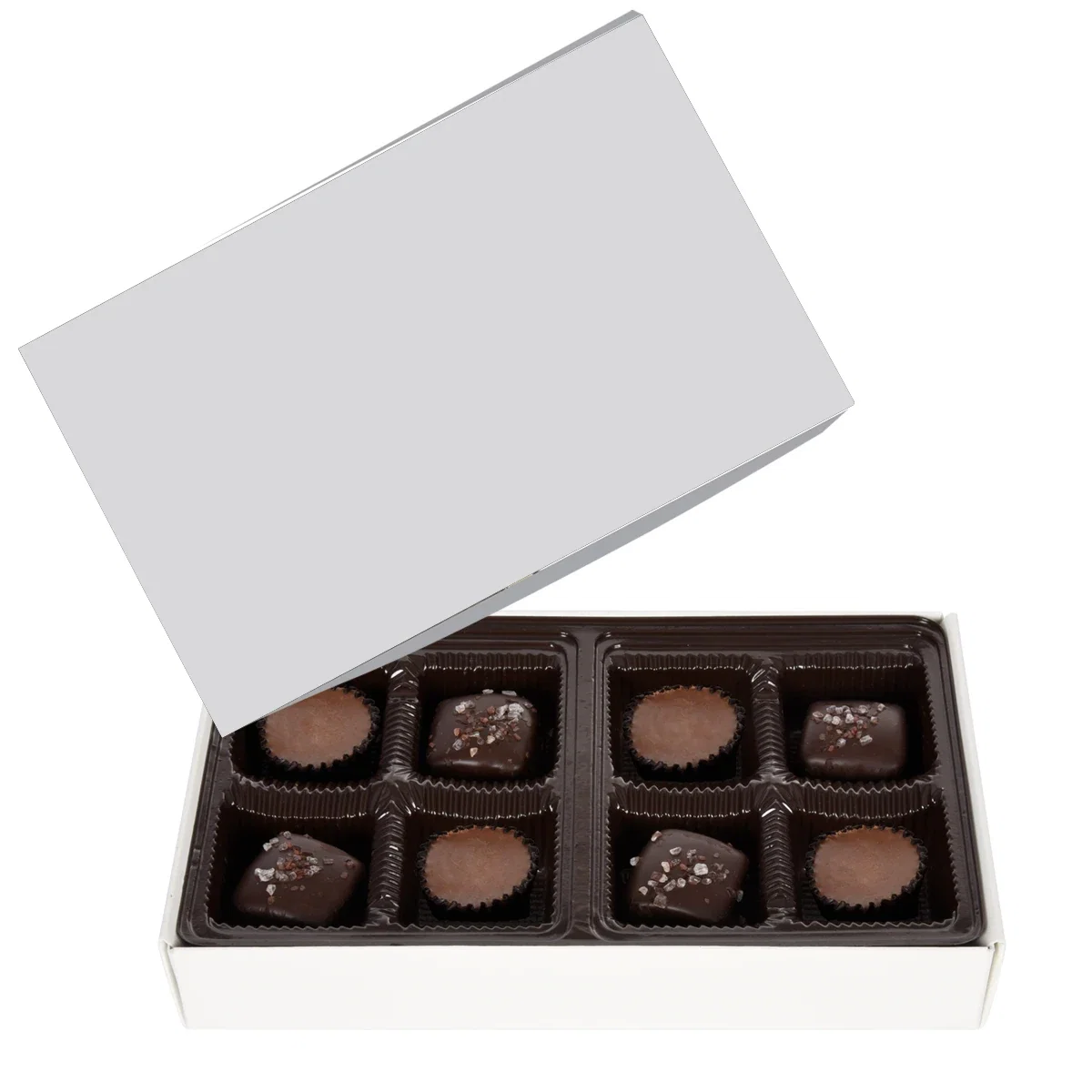 Lid lifted to show the sweets arranged inside