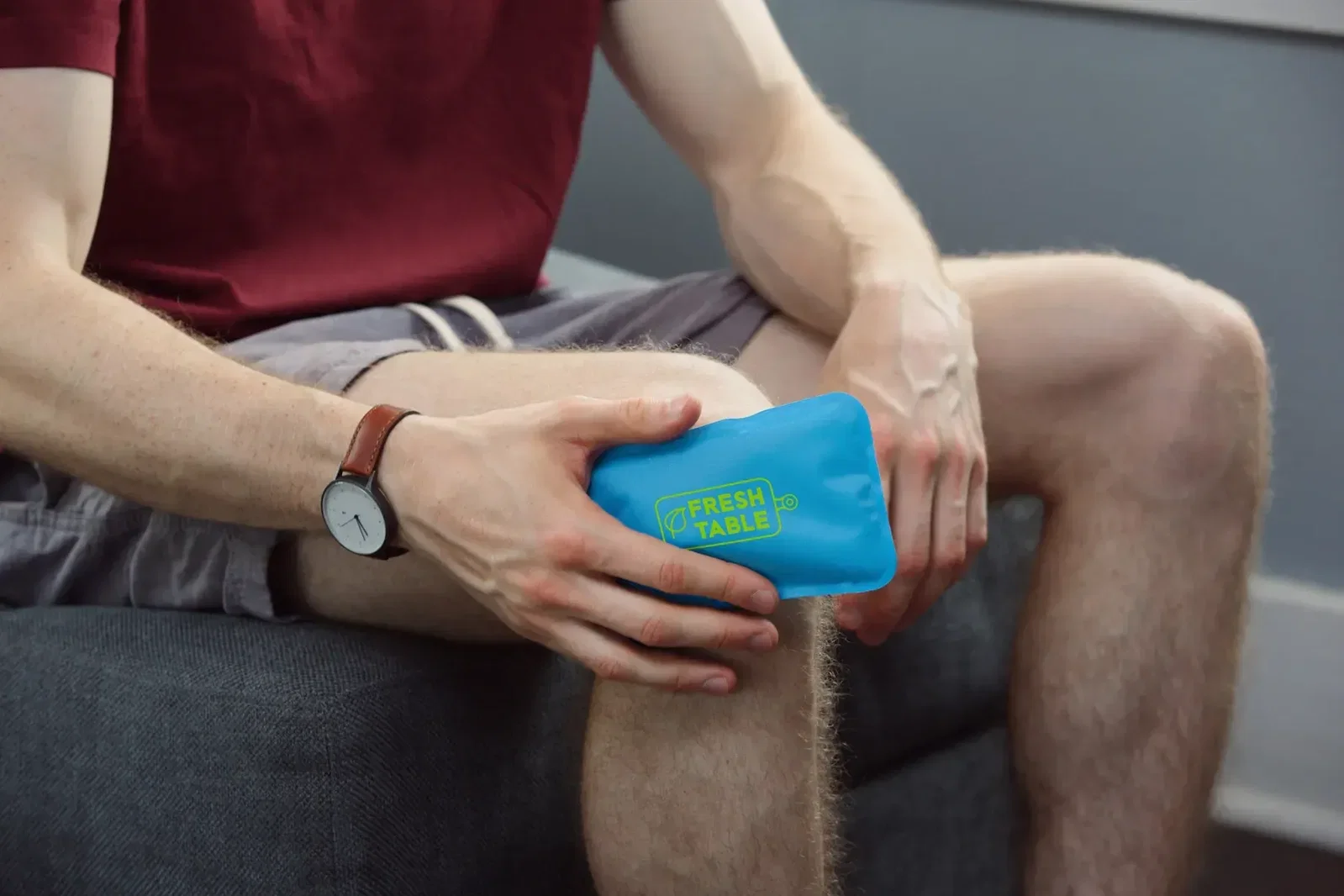Rectangle Nylon-Covered Hot/Cold Pack held in hand