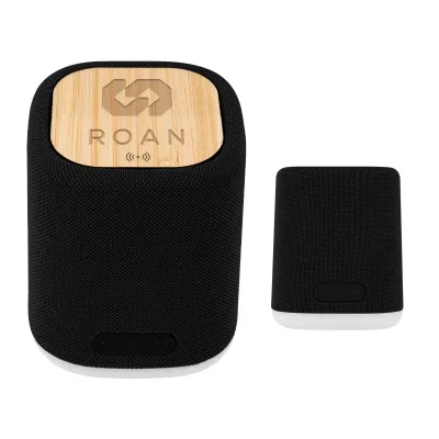 Recycled speaker and wireless charger topped with a bamboo panel