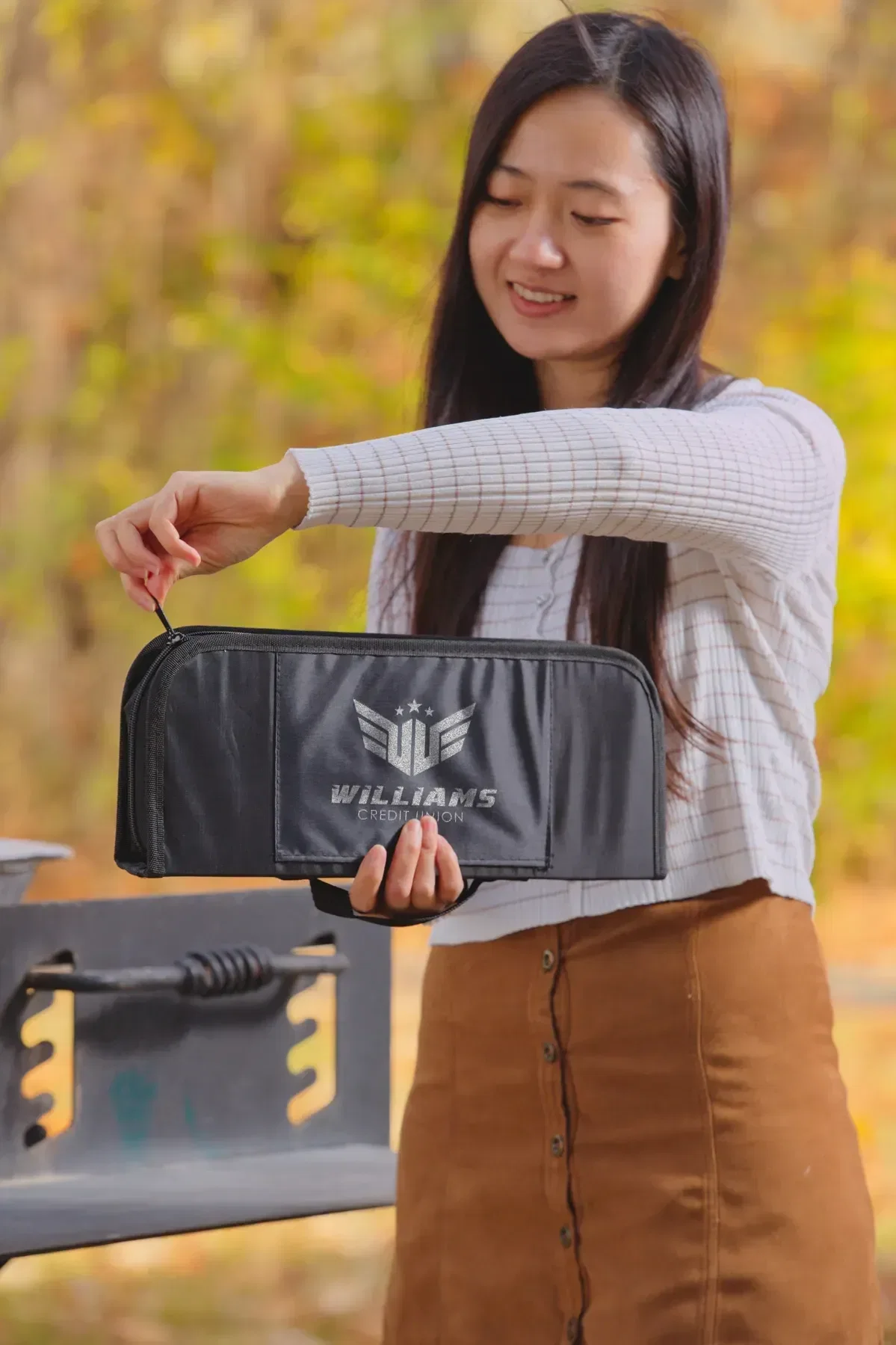 Open custom BBQ case showing all ten stainless grill tools