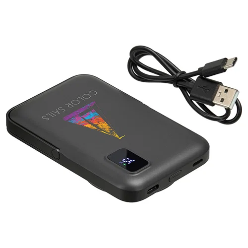 Regal promotional wireless charger powering a phone, in-use shot
